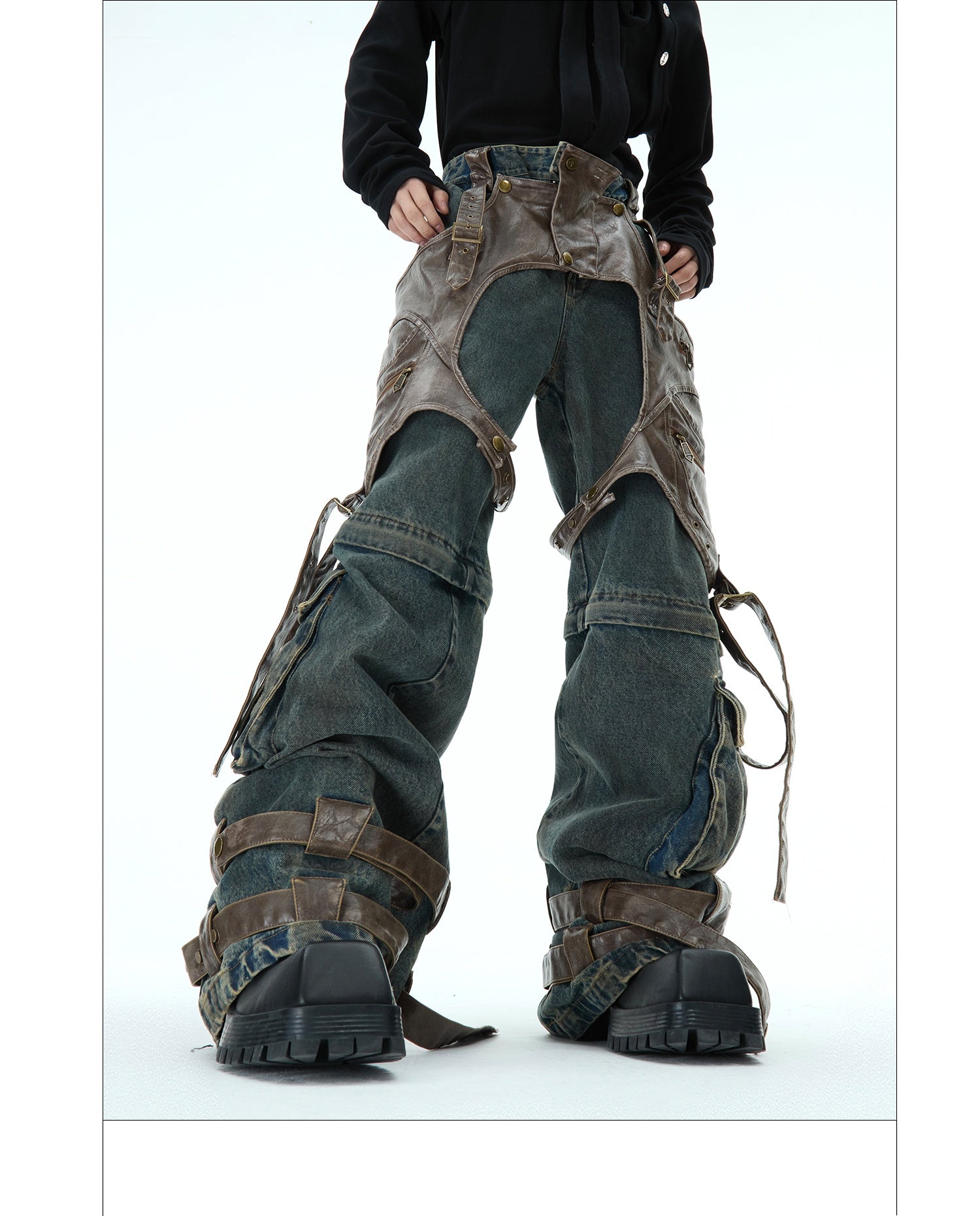 Distressed jeans with multiple pockets and straps on a white background